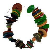Strand of colorful Bakelite buttons arranged in a shape showing variety of sizes and colors on a white background.