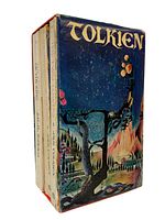 Three vintage Lord of the Rings paperback books in decorative slipcase showing Tolkien-themed fantasy artwork.