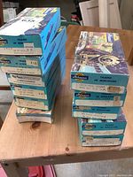 Boxes stacked, each labeled Athearn HO scale train cars with various model and railroad names and prices.