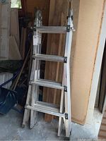 Full view of Vulcan aluminum extension ladder folded, showing 8-foot height and structural details.