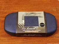 The sealed commemorative package showing the special edition 2000 Loon dollar coin in blue-themed packaging.