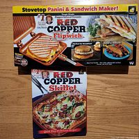 Photo showing the Red Copper Flipwich sandwich maker box with pictures of grilled sandwiches and paninis, emphasizing copper-infused ceramic coating and stovetop use.
