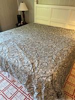 Full view of king size bed with paisley patterned cotton duvet cover displayed, showing the pattern and texture clearly.