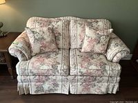 Front view of the Skylar-Peppler floral upholstered loveseat with matching cushions, showing detailing of fabric and overall condition.