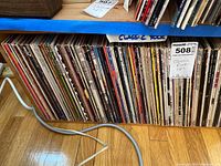 Wide view of vinyl LP records on shelf under label 'Classic Rock LPs'
