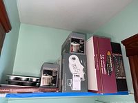 Shelf display of boxed cookware and muffin tins