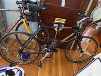 Full left side view of Specialized road bike showing frame, drivetrain, wheels and under-seat bag