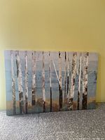 Blue trees canvas print with birch tree motif, blue, brown, and white tones.