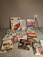 Overview of 15 children's science books about animals, nature, and science.