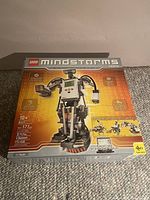Box of LEGO Mindstorms 8527 set with robotic figure image on front and details of included parts and electronics.