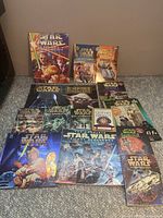 Photo of entire Star Wars books collection laid out on carpet, showing full front covers of all 15 books.