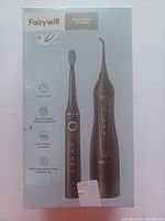 Front of the box showing Fairywill oval care combo with images of electric toothbrush and water flosser in black