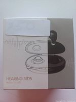 Photo of the front side of the hearing aids box, showing the product image and model number HT-A51