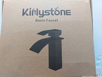 Closed cardboard box with Kirlystone branding and faucet silhouette.