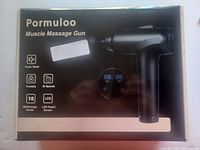 Box of Pormuloo Muscle Massage Gun displaying features such as 30 speeds, 10 massage heads, LCD touchscreen, and portable design.