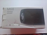 Box of M68 Portable Speaker showing product image and model number.