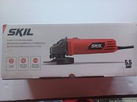 Photo showing Skil angle grinder box front with image of the tool and key specifications such as 5.5 amp motor and 4-1/2 inch size.