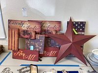 Patriotic multi-panel wall art and large 3D star on table