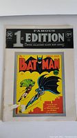 Full cover photo showing '1st Edition Limited Collectors' Silver Mint Series' label plus Batman comic No. 1 cover with Batman and Robin flying, on yellow background with red and black text.