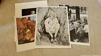 Four posters displayed on beige carpet including black white Marilyn Monroe and other art and photographic posters