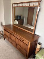 Front view of Kroehler mid-century modern dresser with attached mirror.