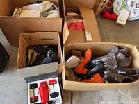 Boxes showing men's clothing, shoe cleaning kit, gloves, t-shirts, and women's shoes in various styles and colors.