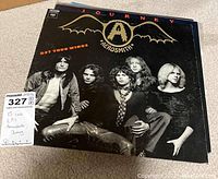 Photo of Aerosmith 'Get Your Wings' vinyl LP album cover showing band members.