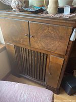 Front view of closed Zenith wood console cabinet