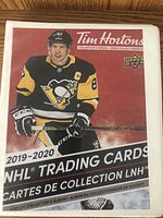 Tim Hortons branded hockey trading card collector's album for 2019-2020 NHL season featuring a player in Pittsburgh Penguins uniform on cover.