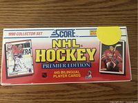 Top front view of the sealed box showing the 1990 Collector Set Score NHL Hockey Premier Edition logo with player images.