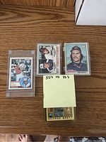 Four cards displayed: Orioles action shot, Strikeout Leaders (Niekro & Ryan), Dennis Eckersley, George Brett