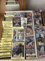 Three long boxes of assorted baseball cards sorted by category with handwritten tabs
