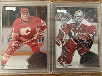 Photo showing two NHL hockey cards that have an error in printing with player names on wrong cards