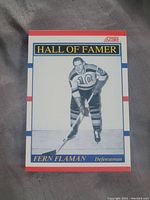 Front side photo of Fern Flaman Hall of Fame hockey card, with player image and title.