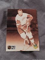 Front of Gordie Howe NHL Pro Set hockey card showing player in Detroit Red Wings uniform and logos.