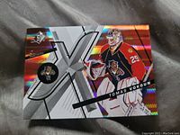 Front side of the holofoil Tomas Vokoun rookie hockey card showing player image, team logo (Florida Panthers), and design with holographic foil.