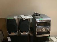 Front view of Sony Mini HI-FI stereo system including two speakers and wiring on top