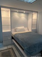 Full assembled Murphy bed unit with mattress, bedding and side towers
