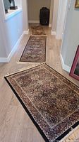 Three Verona area rugs displayed in a hallway, showing size differences and design style