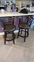 Front view of both bar stools side by side under countertop