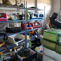 Middle and right shelving units loaded with various items