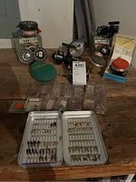Overview of all items including reels, spools, fly boxes with flies