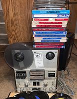 Front view of Masterwork reel to reel tape recorder/player with tape reels loaded and controls visible.