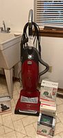 Vacuum unit with four accessory boxes arranged around it