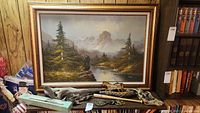 Original oil painting in gold wood frame with driftwood pieces displayed below