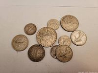 Top view of ten assorted French silver coins showing obverse Sower and other designs