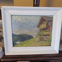 Frontal image of the small oil painting on panel showing a European countryside scene with mountains and a house in a white frame.