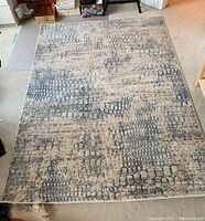 Top view of Torino brand area rug showing full size, placement, and pattern details.