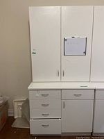 Front view showing upper and lower cabinets aligned side by side