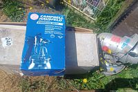 Campbell Hausfeld Automotive Spray Gun in blue box with image and text.